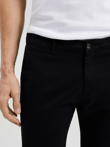 WE Fashion Slimfit Chino hlače | črna barva