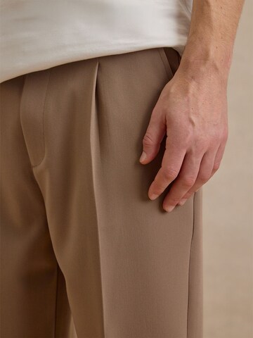 DAN FOX APPAREL Tapered Pleated Pants 'Toni' in Beige