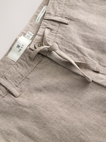 Next Tapered Housut värissä beige