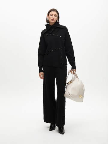 Wide leg Pantaloni di Lola Casademunt in nero