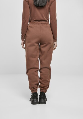 Tapered Pantaloni di Urban Classics in marrone