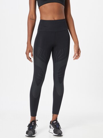 Skinny Pantalon de sport ASICS en noir : devant