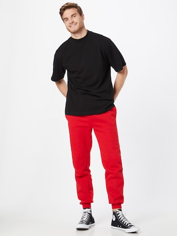 ABOUT YOU Limited - Loosefit Pantalón 'Marlon' en rojo