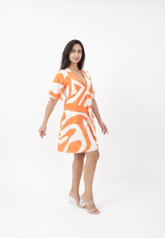 Elara Kjole i orange