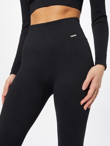 Skinny Pantaloni sportivi di aim'n in nero