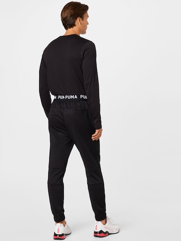 PUMA Tapered Sportbroek in Zwart