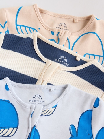 Pijamale de la Next pe bej