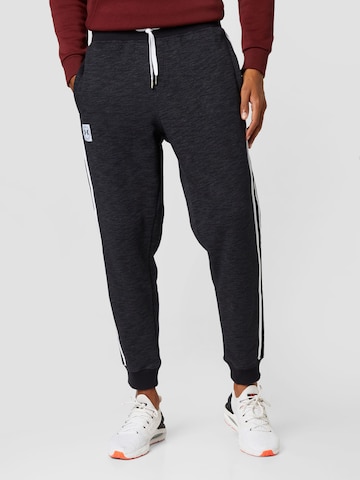 UNDER ARMOUR Regular Sports trousers in Black: front