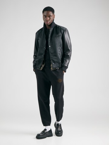 Tapered Pantaloni 'Dacusi' di HUGO in nero