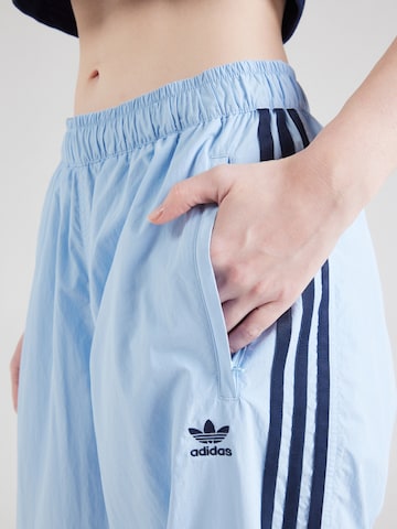 Tapered Pantaloni di ADIDAS ORIGINALS in blu