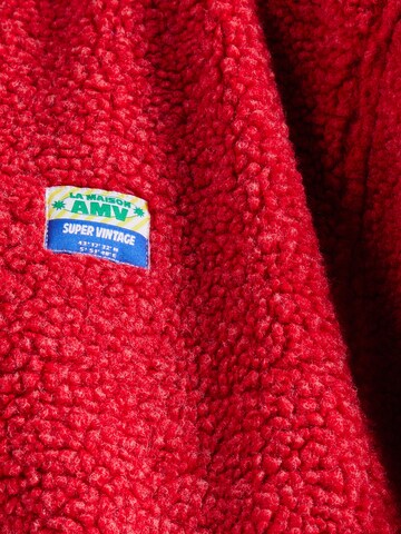 Veste en polaire 'HOKTOWN' AMERICAN VINTAGE en rouge