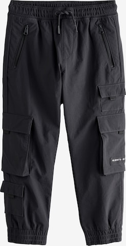 Next Tapered Housut värissä musta: etupuoli