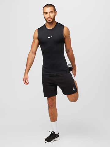 NIKE Koszulka funkcyjna w kolorze czarny
