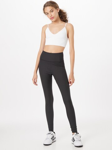 Girlfriend Collective Skinny Sporthose in Schwarz