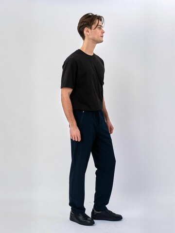 TEESHOPPEN - regular Pantalón ' Track ' en azul