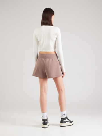 Nike Sportswear Loose fit Trousers 'Phoenix Fleece' in Brown