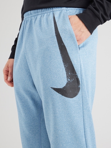 Effilé Pantalon de sport NIKE en bleu