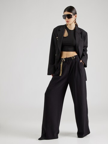 Hoermanseder x About You Loose fit Pleat-front trousers 'Gigi' in Black