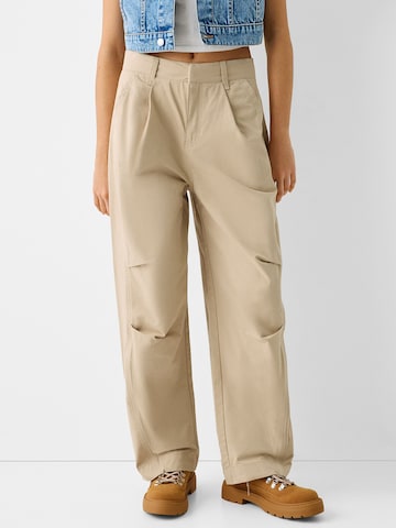 Loosefit Pantalon à pince Bershka en beige : devant