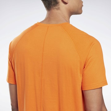 Reebok Функциональная футболка в Оранжевый