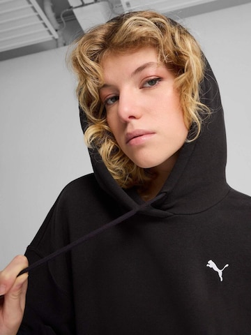 PUMA - Sudadera con cremallera 'Puma Wardrobe Ess Relaxed Cropped Hoodie Tr' en negro
