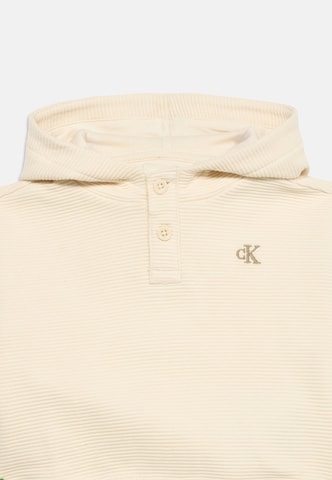 Bluză de molton de la Calvin Klein Jeans pe bej