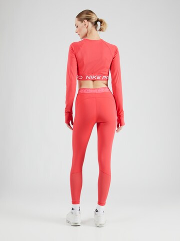 NIKE Skinny Spodnie sportowe w kolorze różowy