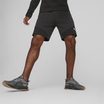 PUMA - Regular Calças de desporto 'EVOSTRIPE' em preto: frente