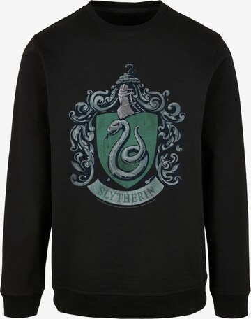 Felpa 'Harry Potter - Distressed Slytherin Crest' di ABSOLUTE CULT in nero: frontale