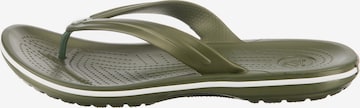 Flip-flops de la Crocs pe verde