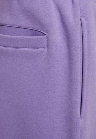 Wide leg Pantaloni di Urban Classics in lilla