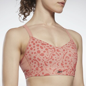 Bustino Reggiseno sportivo di Reebok in arancione