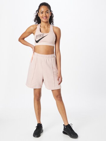 rožinė Nike Sportswear Laisvas Kelnės