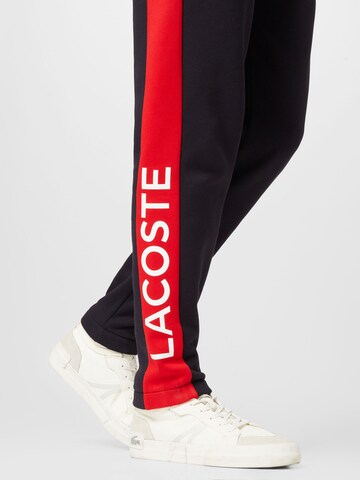 LACOSTE - Tapered Pantalón en negro