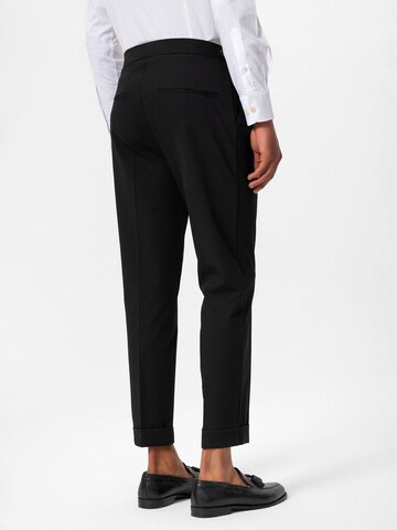 Antioch Tapered Pleat-front trousers in Black