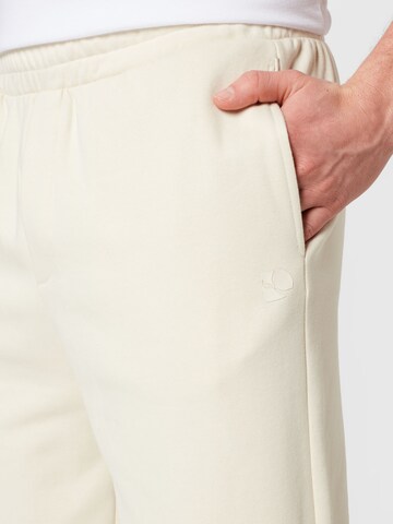 Tapered Pantaloni di TOM TAILOR DENIM in beige