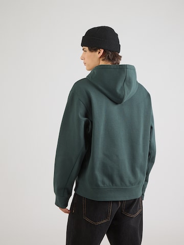 Carhartt WIP - Sudadera con cremallera 'American Script' en verde