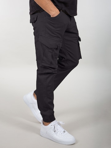 Coupe slim Pantalon cargo 'Spy Pant' ALPHA INDUSTRIES en noir