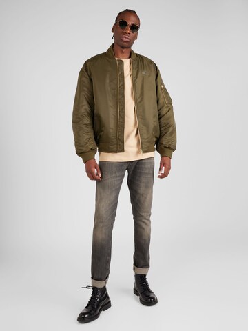 Veste mi-saison 'Authentic' Tommy Jeans en vert