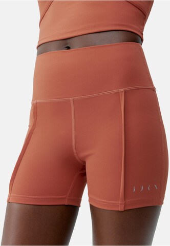 Born Slim fit Trousers with creases 'Sayani' in Orange