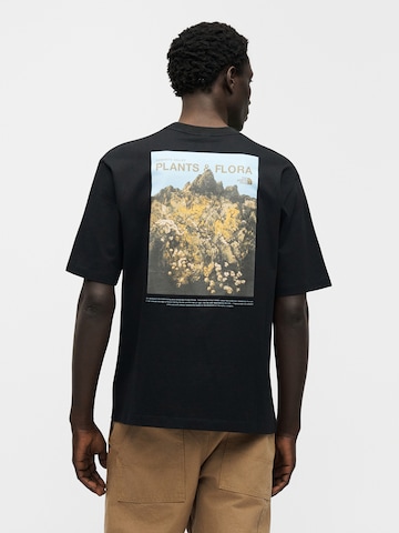 THE NORTH FACE Tričko 'PLANT & FLORA' - Čierna: predná strana