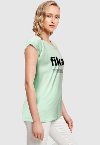 T-shirt 'Fika Definition' Mister Tee en vert