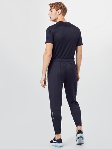NIKE Tapered Sportbroek 'Wild Run' in Zwart