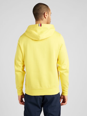 TOMMY HILFIGERSweater majica 'MONOGRAM IMD HOODIE' - žuta boja