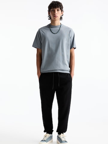 Tapered Pantaloni di Pull&Bear in nero