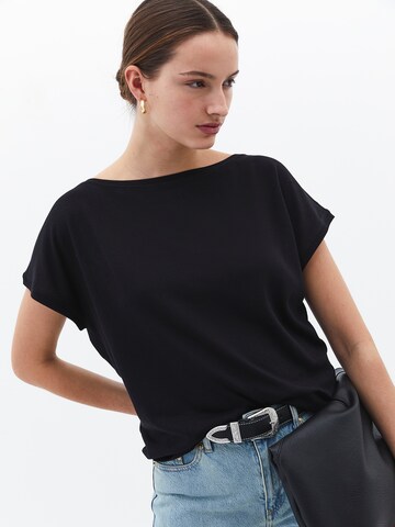 Maglietta di OXXO in nero: frontale