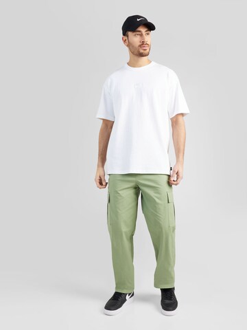 Nike Sportswear tavaline Klapptaskutega püksid 'CLUB', värv roheline