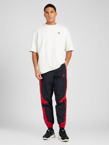 Tapered Pantaloni 'JAM WARM UP' de la Jordan pe negru