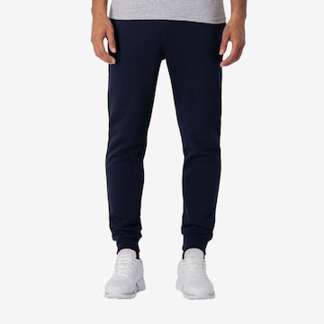 Effilé Pantalon de sport Champion Authentic Athletic Apparel en bleu : devant