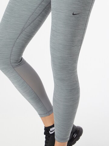 NIKE Skinny Workout Pants in Grey